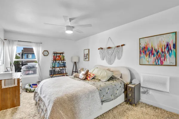 a bedroom with a bed and a flat screen tv