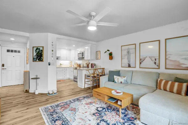 a very nice looking room with a large window and wooden floor