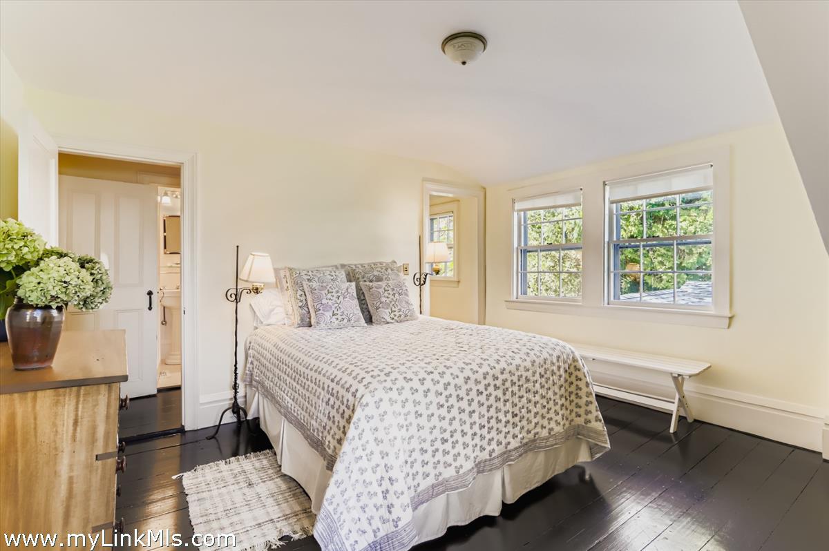 27 Spring Street Vineyard Haven, MA 02568 - Photo 41 of 58 a bedroom with a bed and a window
