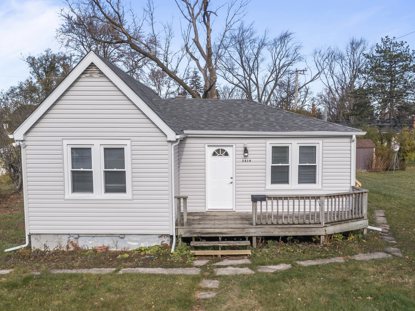 a view of a house with a roof deck