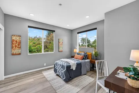 a bed room with a bed and a window