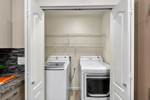 a utility room with dryer and washer
