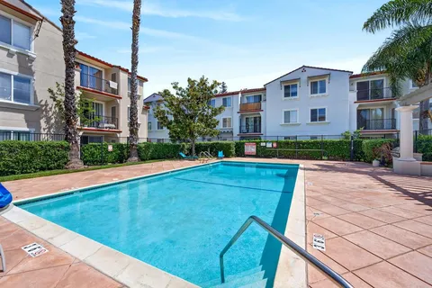 a house view with garden space and trees