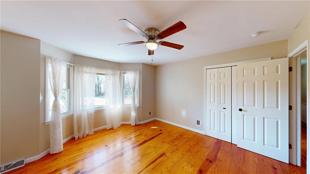 1042 Mission Road Southwest Cartersville, GA 30120 - Photo 25 of 40 a view of a livingroom with a ceiling fan and window