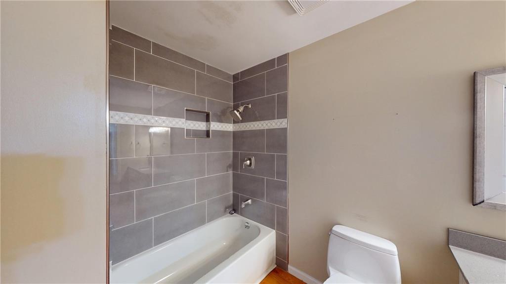 1042 Mission Road Southwest Cartersville, GA 30120 - Photo 27 of 40 a bathroom with a shower and toilet