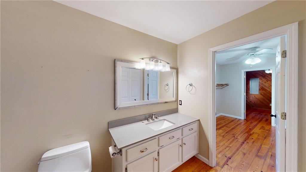 1042 Mission Road Southwest Cartersville, GA 30120 - Photo 28 of 40 a bathroom with a sink and a mirror