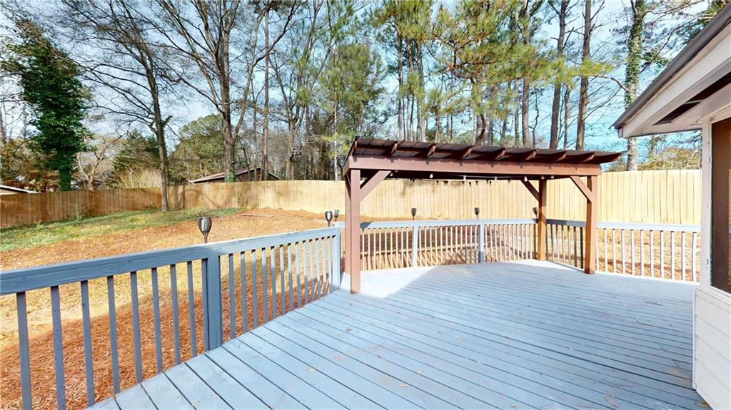 1042 Mission Road Southwest Cartersville, GA 30120 - Photo 36 of 40 a view of a house with a deck