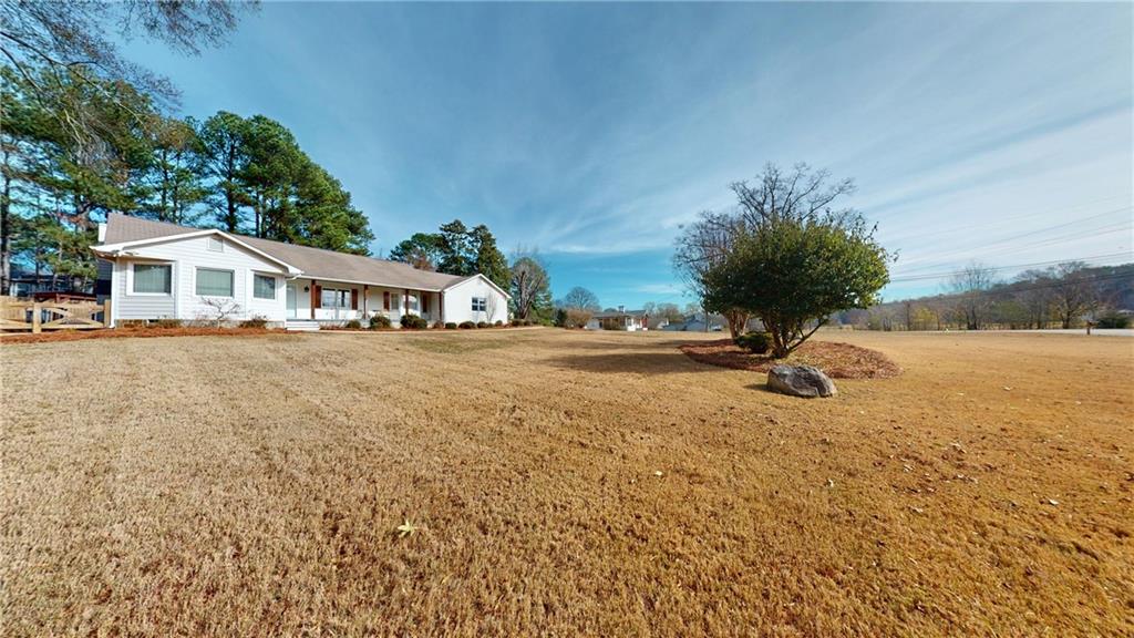 1042 Mission Road Southwest Cartersville, GA 30120 - Photo 4 of 40 a view of a house with a yard