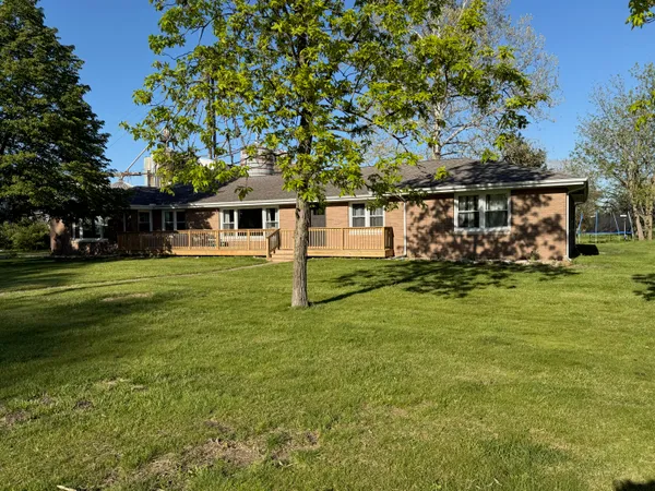 a view of a house with a big yard