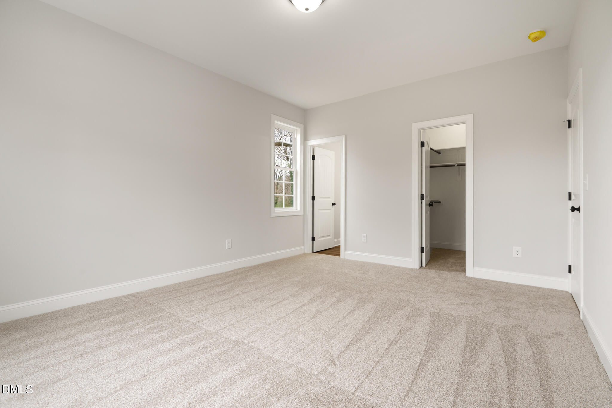 374 Vicksboro Road Henderson, NC 27536 - Photo 12 of 23 a view of an empty room with closet and a window