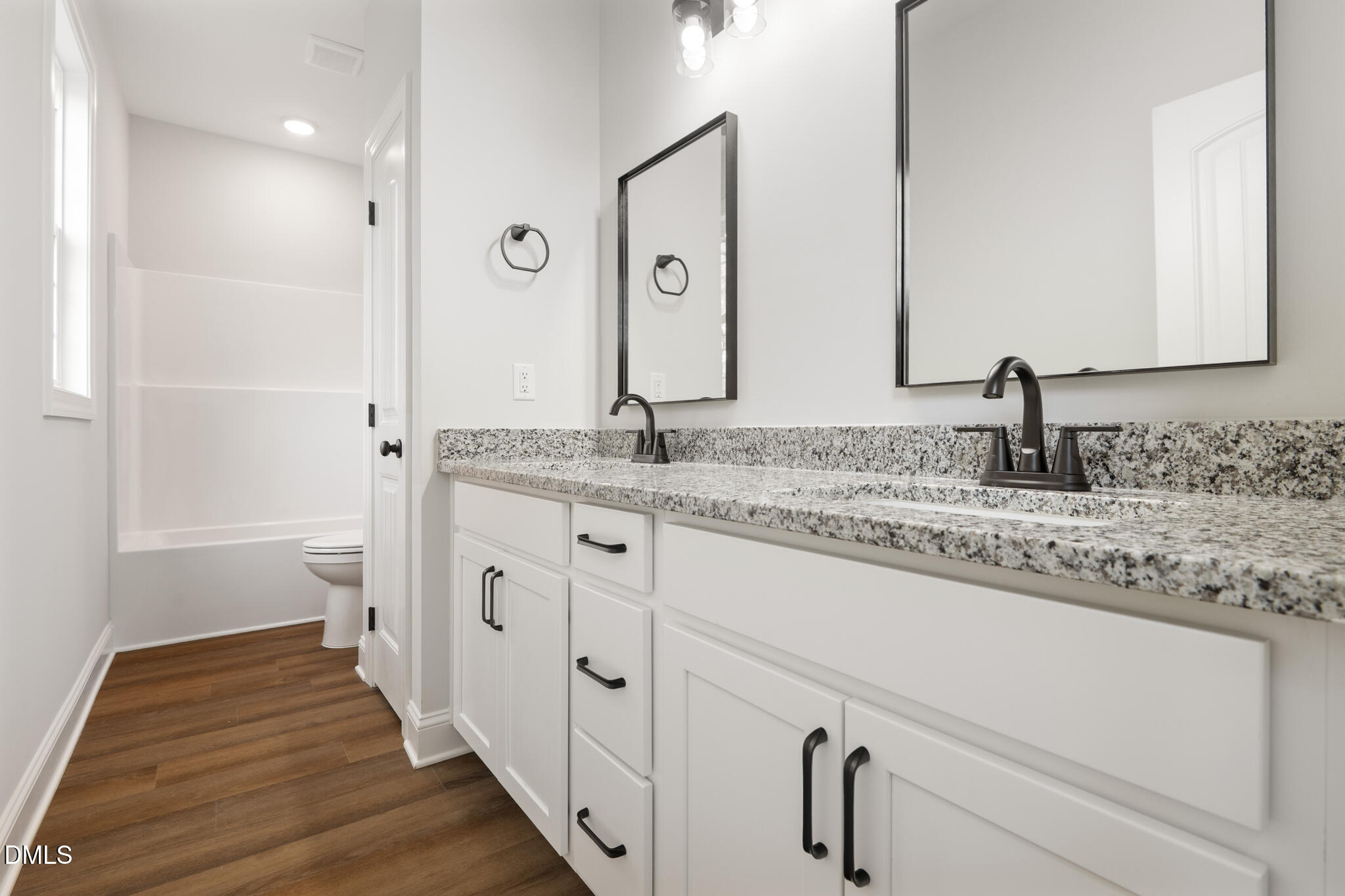 374 Vicksboro Road Henderson, NC 27536 - Photo 14 of 23 a bathroom with double vanity and a granite counter tops