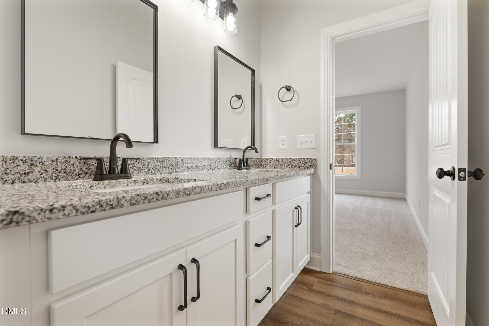 374 Vicksboro Road Henderson, NC 27536 - Photo 15 of 23 a bathroom with double sink and a mirror