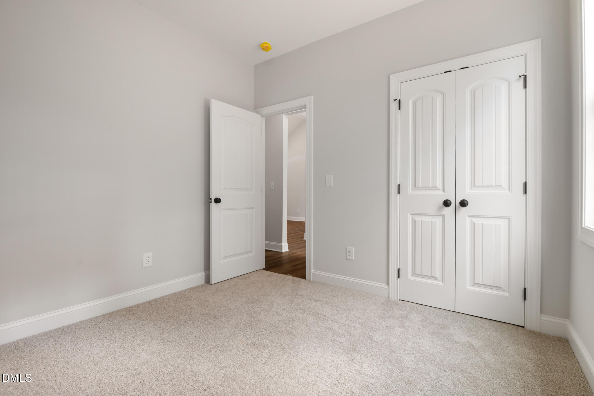 374 Vicksboro Road Henderson, NC 27536 - Photo 16 of 23 an empty room with an entryway and closet area