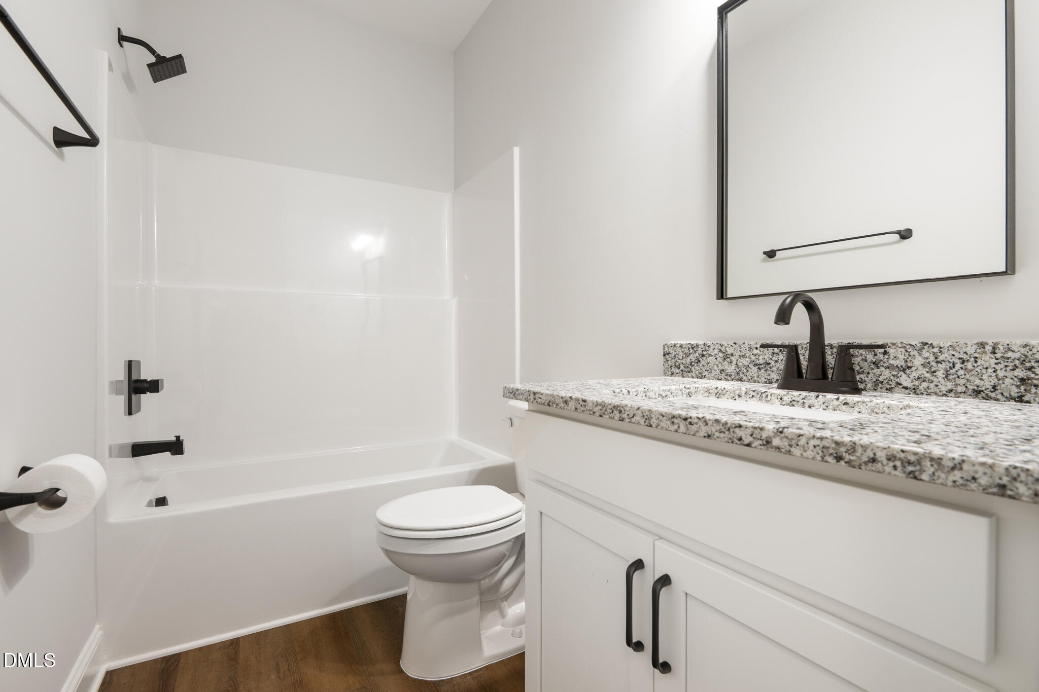 374 Vicksboro Road Henderson, NC 27536 - Photo 19 of 23 a bathroom with a granite countertop sink toilet and shower
