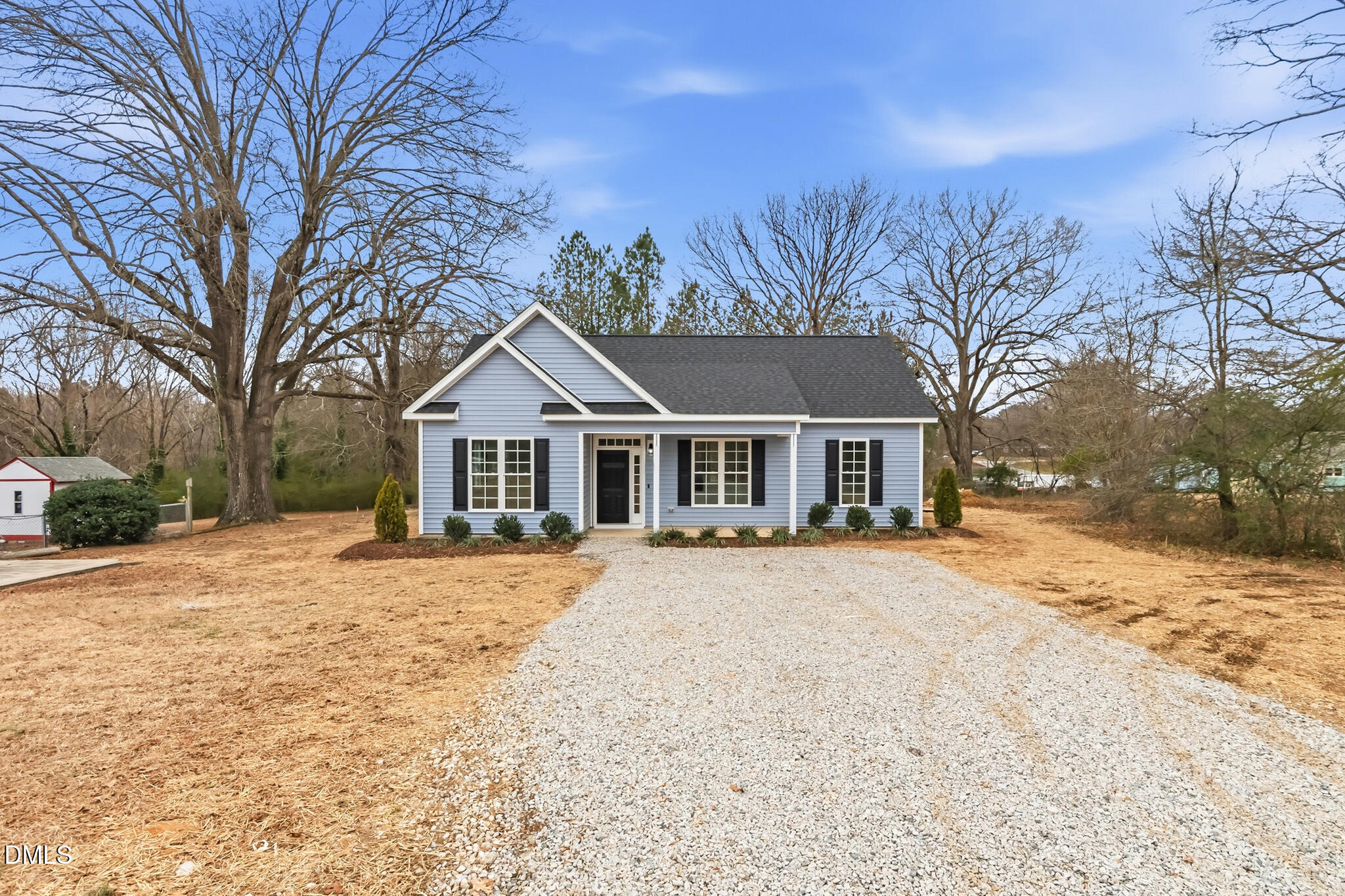 374 Vicksboro Road Henderson, NC 27536 - Photo 4 of 23 a front view of a house with a yard covered in snow