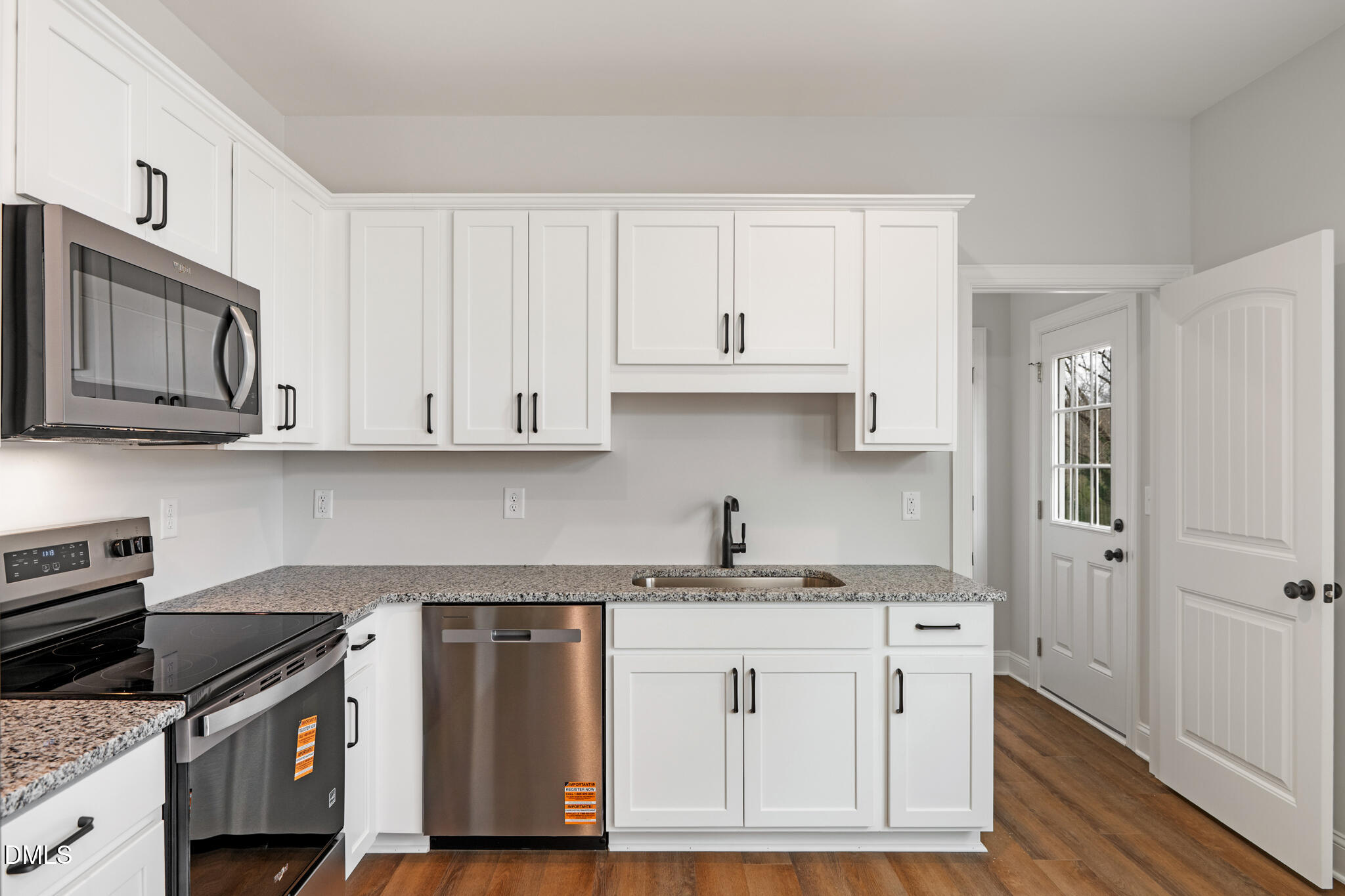 374 Vicksboro Road Henderson, NC 27536 - Photo 9 of 23 a kitchen with stainless steel appliances granite countertop a stove a sink and a refrigerator