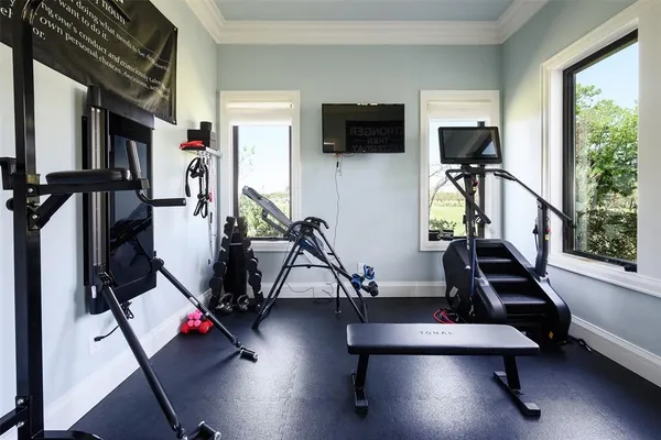 a bedroom with furniture and a flat screen tv