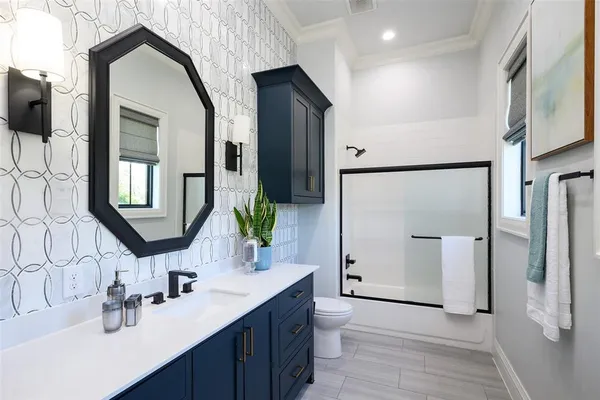 a bathroom with a double vanity sink and mirror