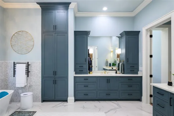 a bathroom with a granite countertop sink a toilet and a mirror