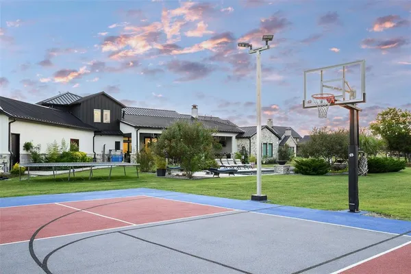 a kitchen with a sink cabinets and a window