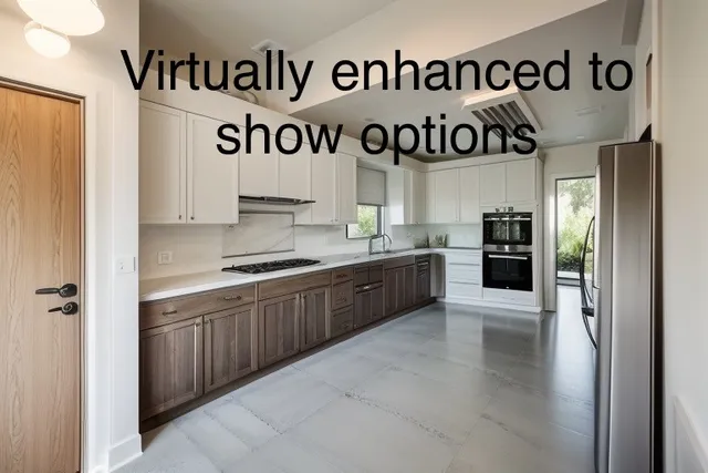 a large kitchen with a refrigerator and a sink