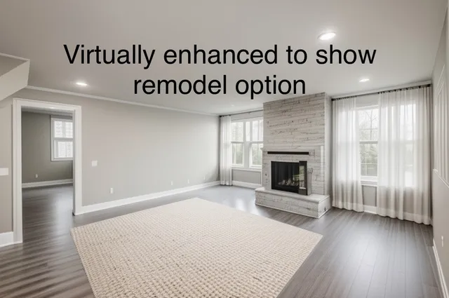 a view of an empty room and wooden floor