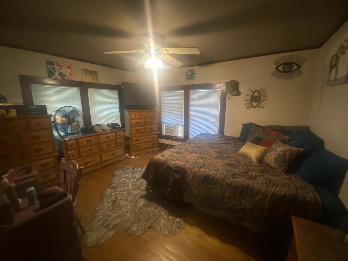 540 North 7th Street DeKalb, IL 60115 - Photo 12 of 14 a large bed sitting in a bedroom next to a window