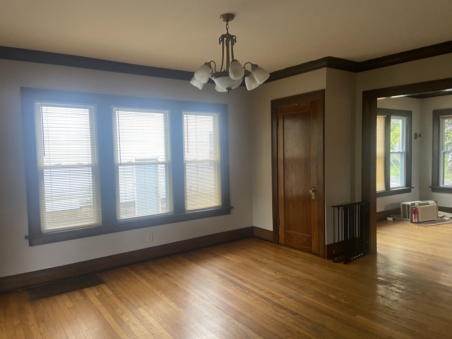 540 North 7th Street DeKalb, IL 60115 - Photo 4 of 14 a view of an empty room with wooden floor and a window