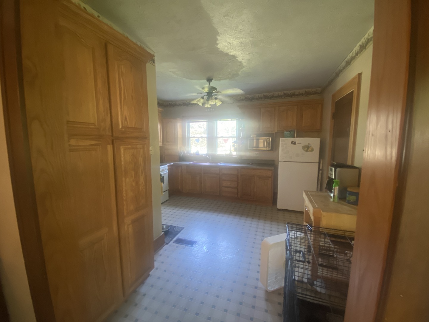 540 North 7th Street DeKalb, IL 60115 - Photo 7 of 14 a kitchen with refrigerator and windows