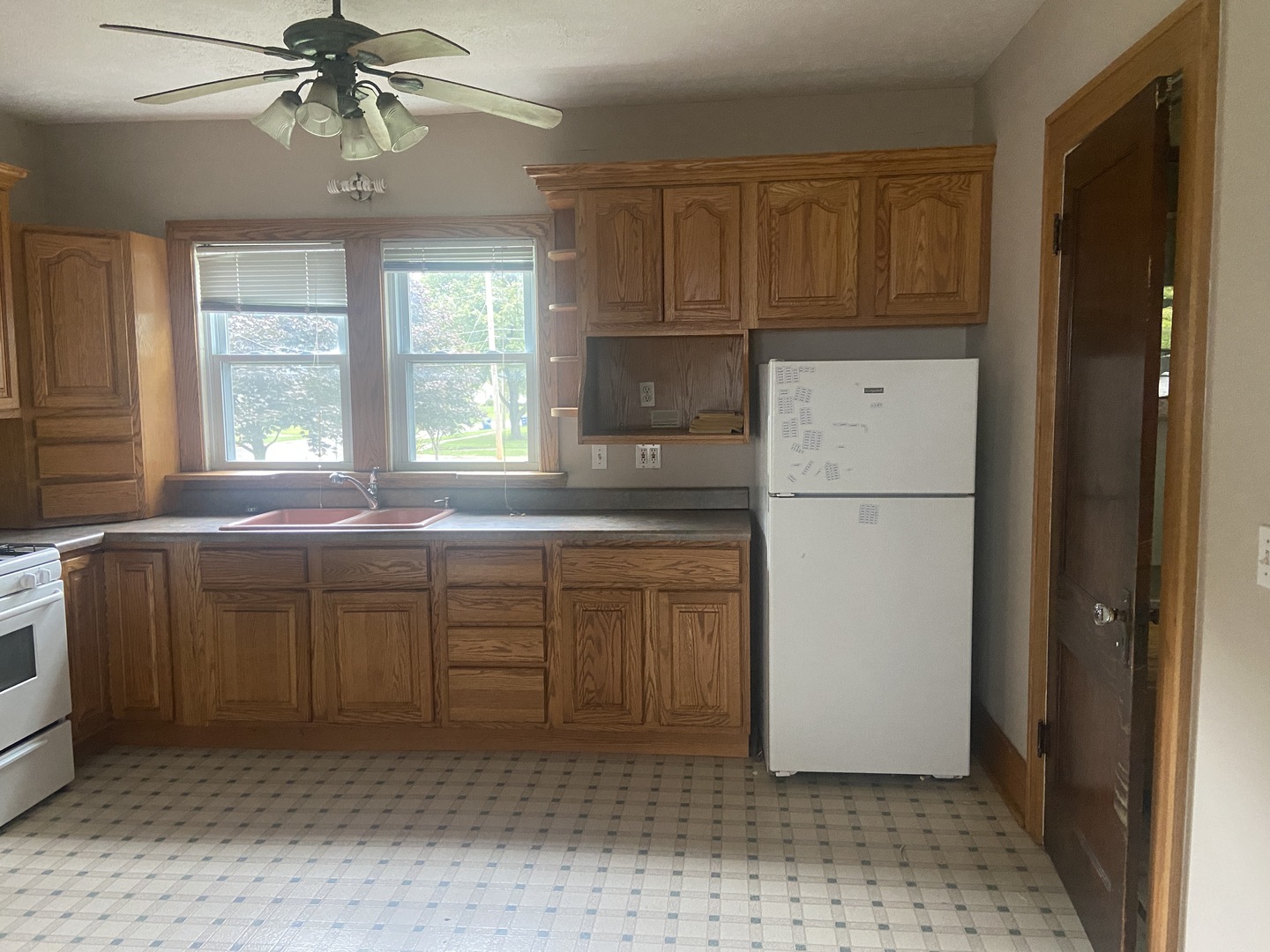 540 North 7th Street DeKalb, IL 60115 - Photo 8 of 14 a kitchen with a refrigerator a sink and dishwasher