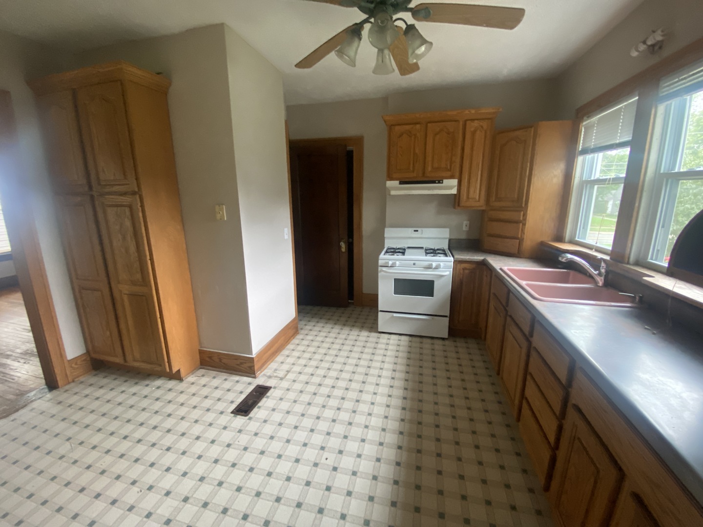 540 North 7th Street DeKalb, IL 60115 - Photo 9 of 14 a kitchen with refrigerator and windows