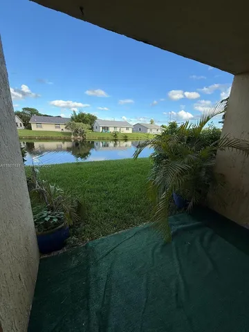 a view of a garden from a lake