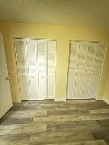 a view of wooden floor and cabinet