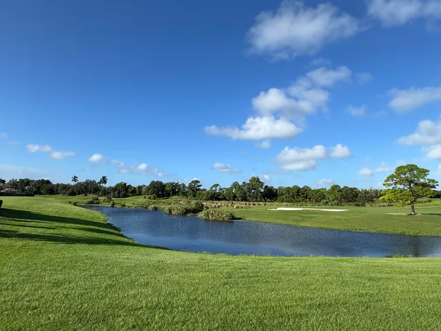 a view of a golf course with a lake