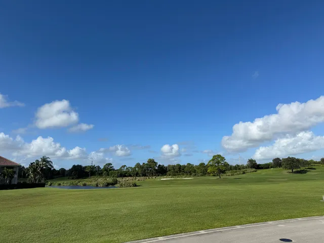 a view of a golf course with a lake