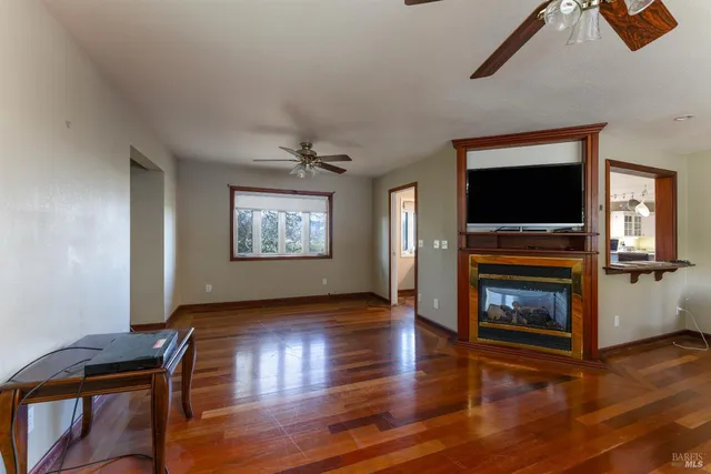 a large kitchen with a table and chairs