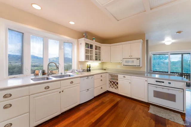 a bathroom with a sink mirror and toilet