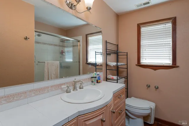 a bathroom with a tub toilet and sink