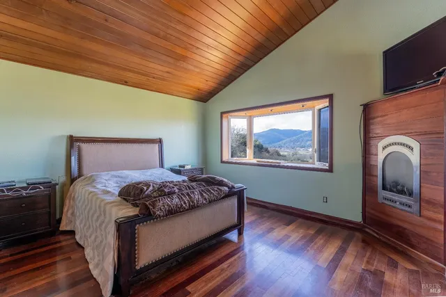 a bathroom with a large window and a bathtub
