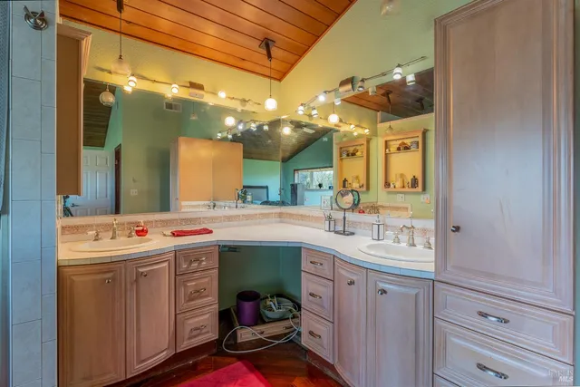 a kitchen with a sink and cabinets
