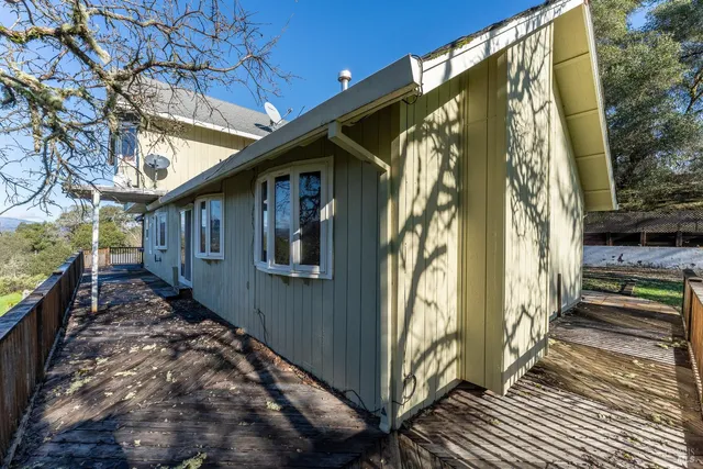 a aerial view of a house with a yard