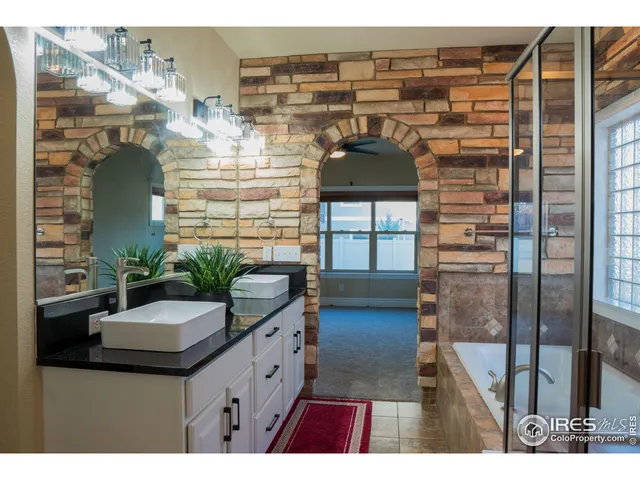 a picture of a bathroom with a sink and mirror