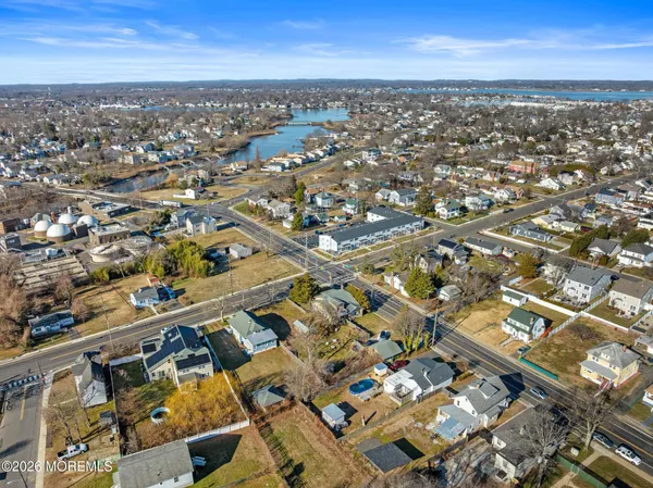 an aerial view of a city with ocean view