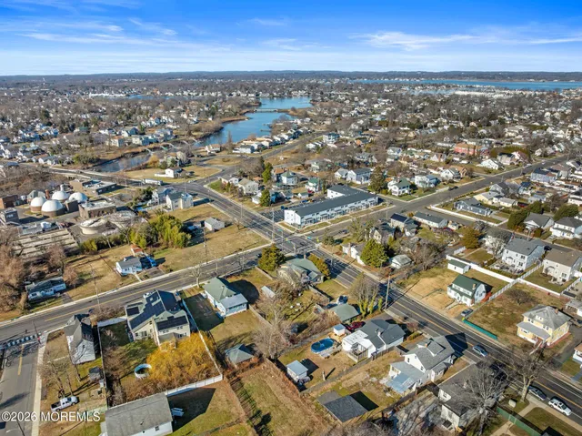 an aerial view of residential building and ocean