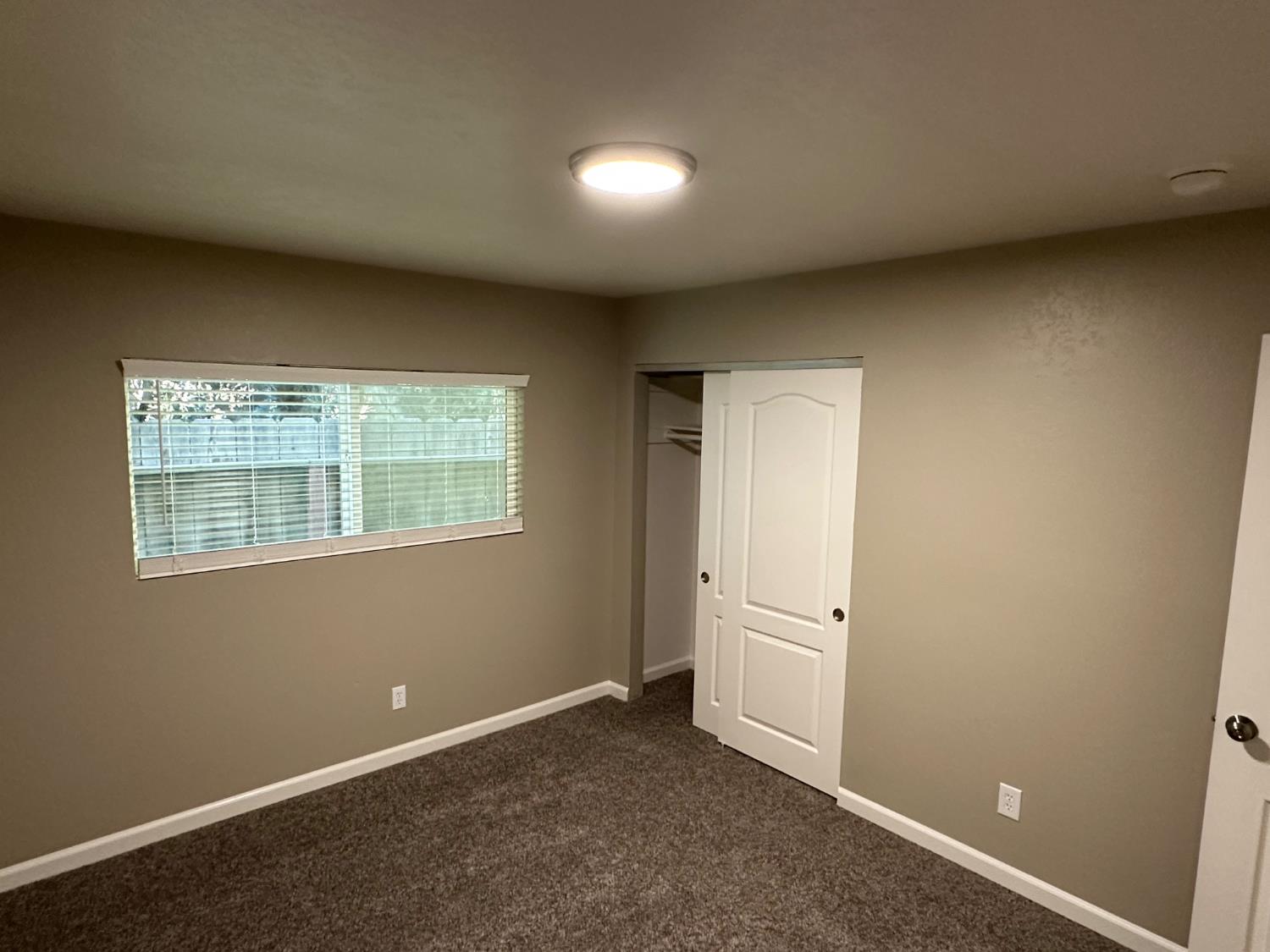 924 Kingery Drive Ripon, CA 95366 - Photo 15 of 18 an empty room with windows