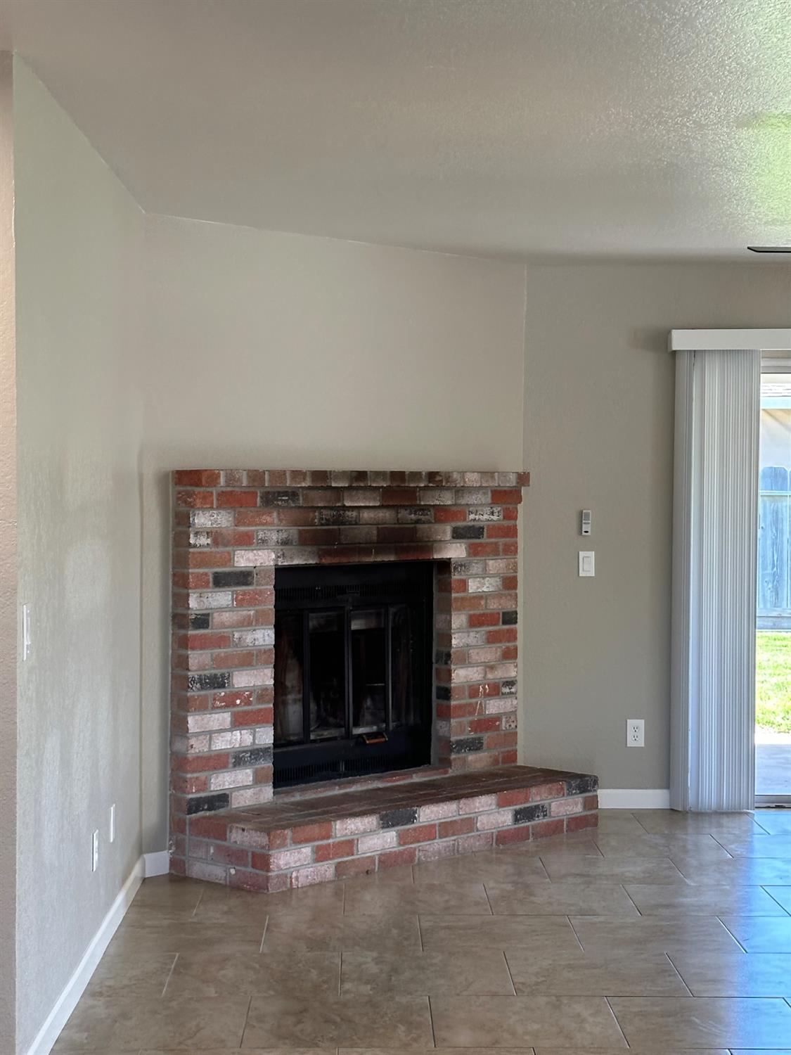 924 Kingery Drive Ripon, CA 95366 - Photo 7 of 18 a living room with a fireplace