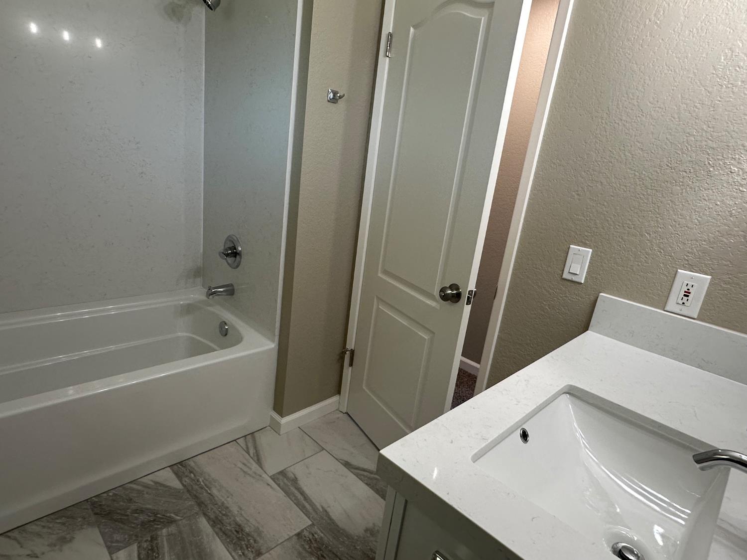 924 Kingery Drive Ripon, CA 95366 - Photo 8 of 18 a bathroom with a bathtub and shower