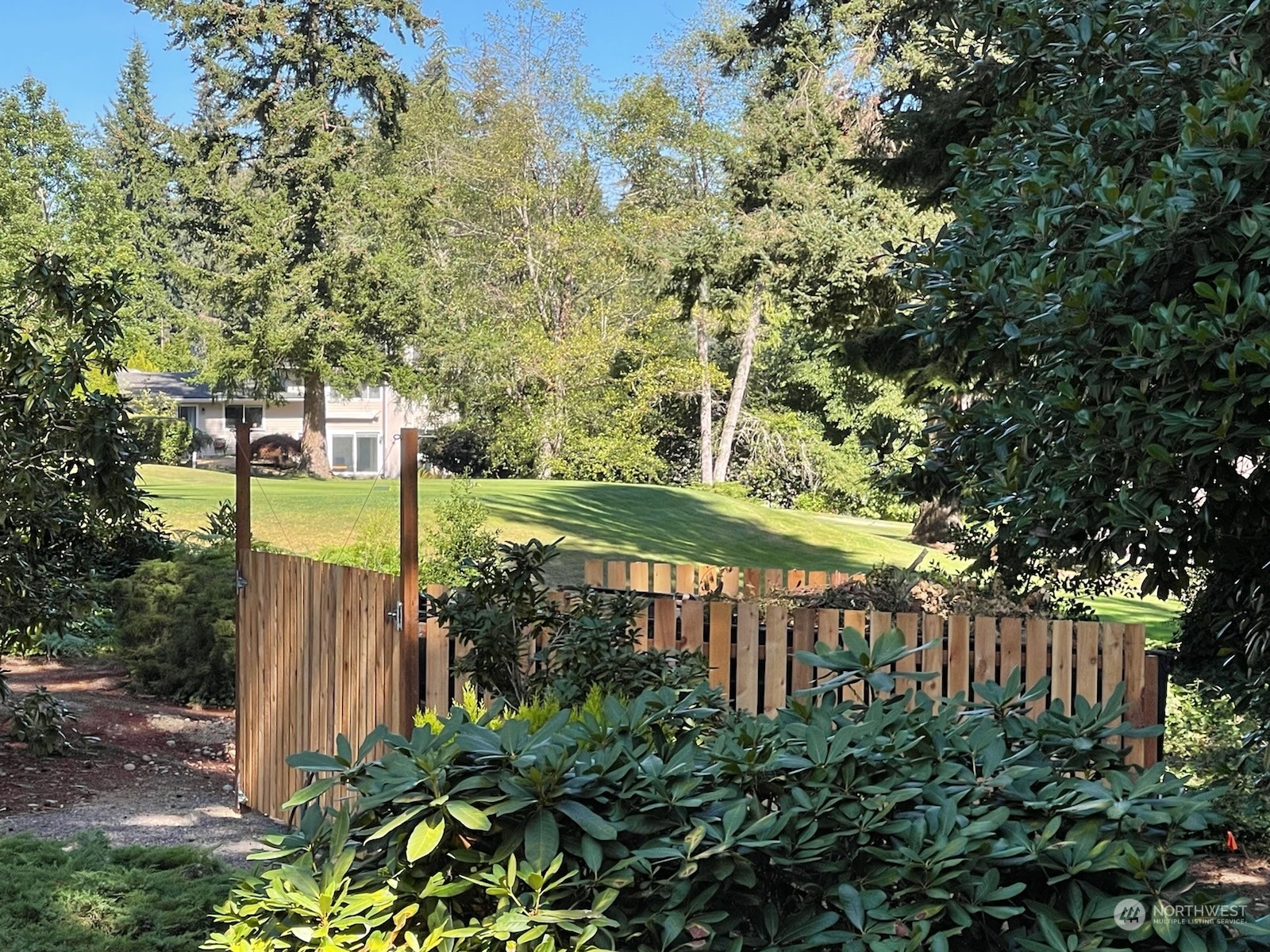 17420 147th Avenue Southeast, Unit 6 Renton, WA 98058 - Photo 18 of 32 a view of a garden with large trees