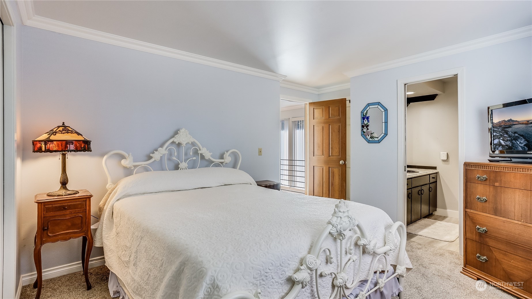 17420 147th Avenue Southeast, Unit 6 Renton, WA 98058 - Photo 26 of 32 a bedroom with a bed and a lamp on dresser