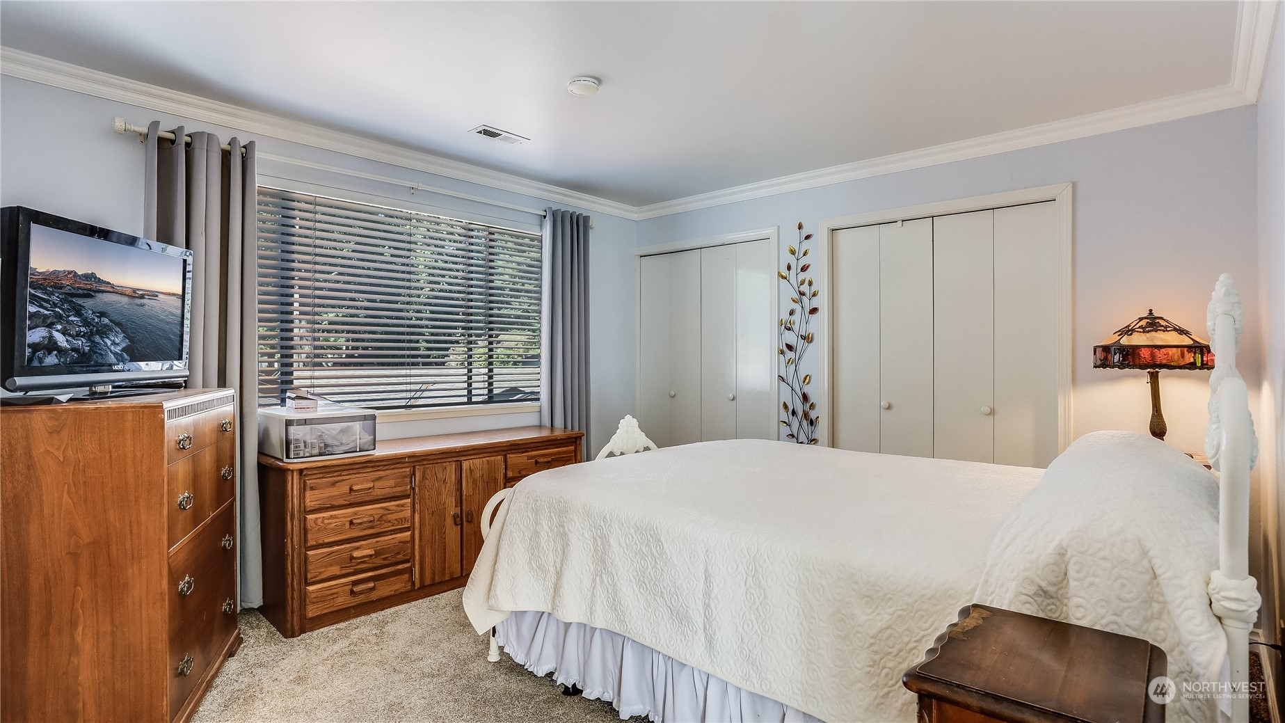 17420 147th Avenue Southeast, Unit 6 Renton, WA 98058 - Photo 27 of 32 a bedroom with a bed and a painting on the wall